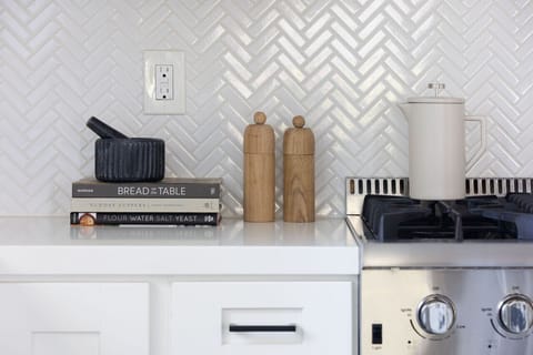 Custom Herringbone tile, Quartz countertops and beautiful design perfect for inspiring any recipe.