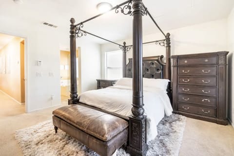 Indulge in opulent comfort in our master bedroom.