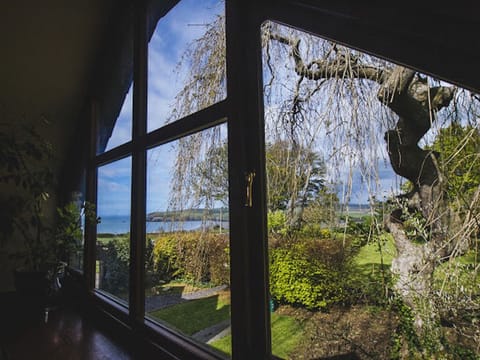 Our dramatic view window of the main garden and Sea below