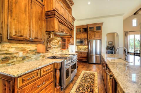 Chef's kitchen with double oven and large kitchen island for entertaining