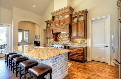 Chef's kitchen with double oven and large kitchen island for entertaining