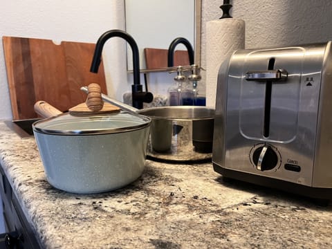 Fridge, microwave, coffee/tea maker, cookware/dishes/utensils