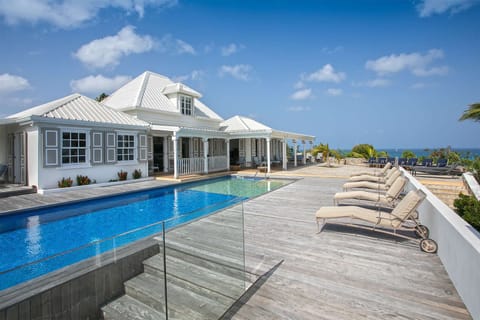 An infinity pool, sun loungers