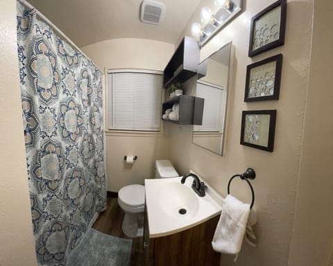 Combined shower/tub, hair dryer, towels, soap