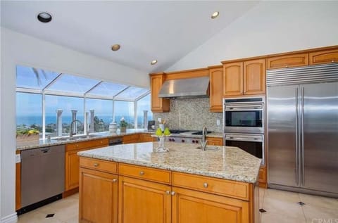 Kitchen with upscale appliances and sweeping ocean views.