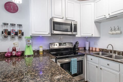 Enjoy the comfort of this fully stocked kitchen, with coffee & waffle maker. 
