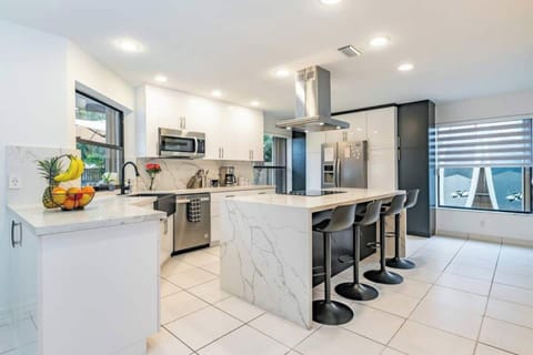 Fully equipped chef kitchen in Fox Island's open space, new appliances and culinary bliss