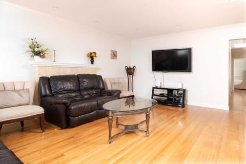 The living room has equally comfy sitting areas plus a TV ...