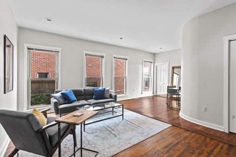 Bright, open living space including smart TV and futon