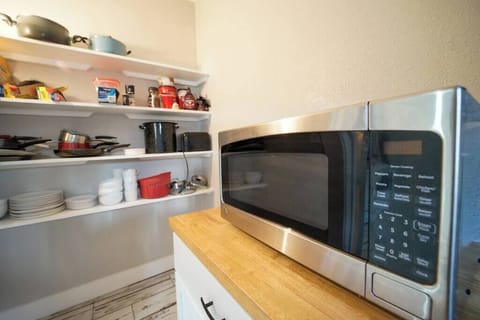 Fridge, coffee/tea maker, cookware/dishes/utensils