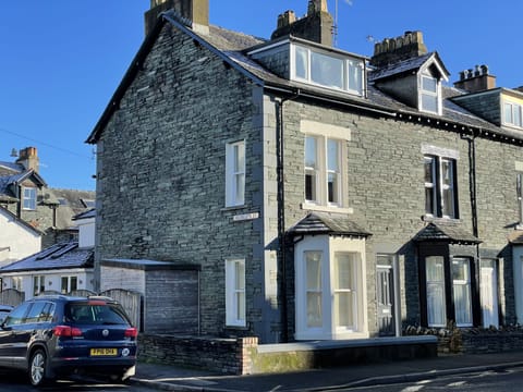 The property is an attractive end-terrace house built with locally mined slate stone