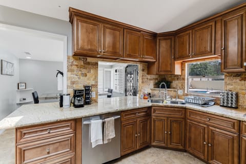 Modern kitchen with stylish bar, perfect for dining and culinary fun.