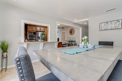 Stylish gray table, chairs, and bench—perfect for meals and gatherings.