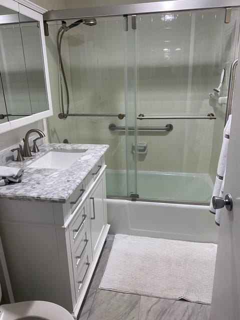 Combined shower/tub, hair dryer, towels, soap