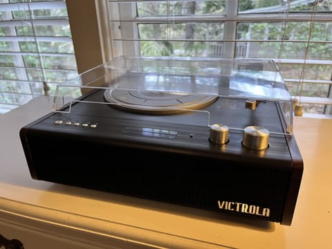 Victrola record player with Bluetooth speaker.