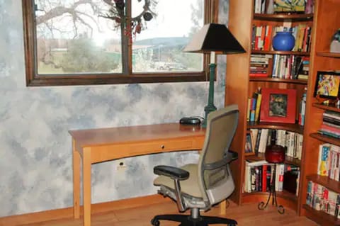 Middle bedroom - frequently utilized as a work space.  Full size bed