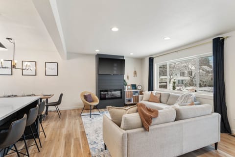 Gather the family around the fireplace for a movie night with the 55" Roku TV.