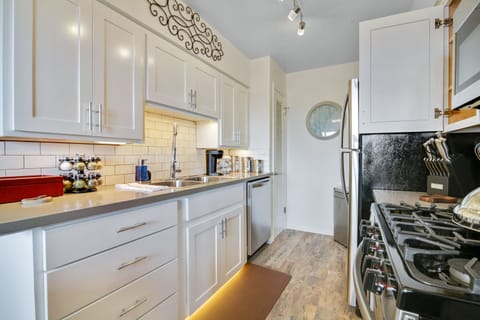 Prepare meals in this fashionable kitchen with essential appliances and utensils