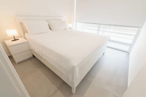 Bedroom with Queen-sized bed and balcony