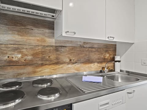 Cabinetry, Property, Countertop, Kitchen Appliance, Kitchen Stove, Gas Stove, Cooktop, Kitchen, Stove, Home Appliance