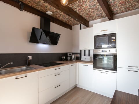 Kitchen, Countertop, Interior Design, Kitchen Appliance, Flooring, Wood, Ceiling, Light Fixture, Cabinetry, Furniture