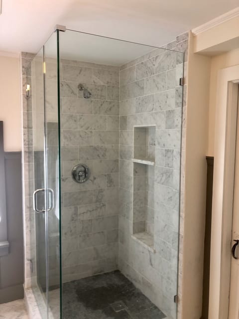 Master bathroom Italian marble corner shower with radiant floor (winter).