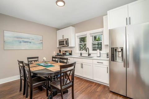 Downstairs unit fully stocked kitchen with seating for 6 at kitchen table, and an additional two at breakfast bar.