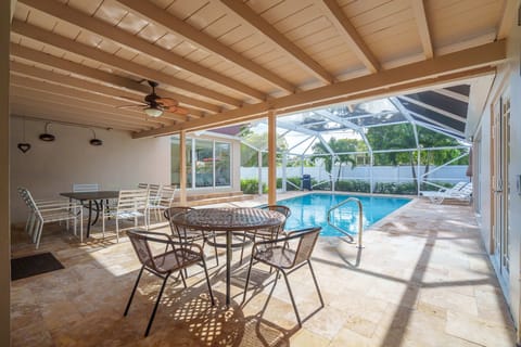 A heated pool, sun loungers