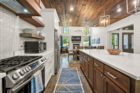 Sleek and well-equipped, this kitchen offers all the essentials for preparing meals while still keeping an inviting, rustic vibe.
