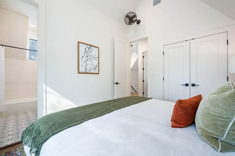 King bedroom ensuite with room darkening shades