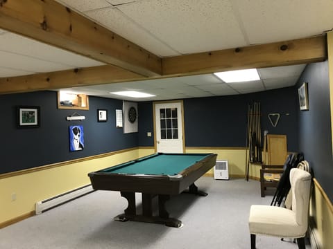 Full finished basement with pool table and two extra beds (full and twin). 
