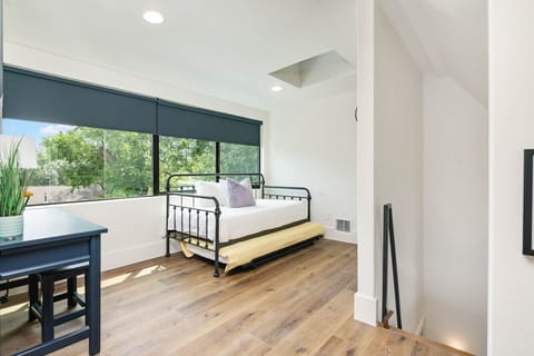 Loft bedroom with 2 twin daybeds/2 trundles and work area