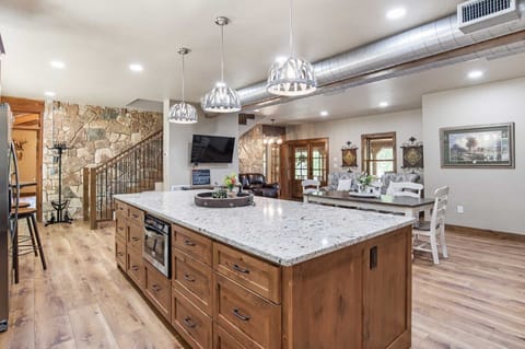 The enormous island in the kitchen serves not only as ample prep space for meals, but a buffet-style serving area, too!