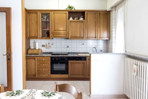 Fridge, oven, dishwasher, dining tables