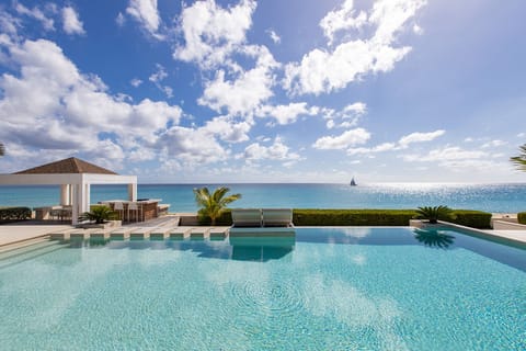 An infinity pool, sun loungers