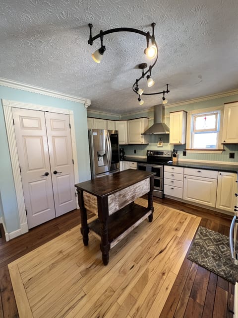 Fully stocked kitchen with electric stove/oven, dishwasher, pantry, fridge