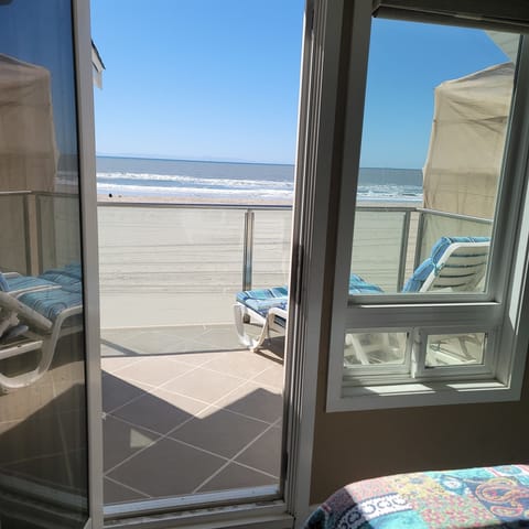 Patio on the second floor off of the bedroom on the right with two twin beds