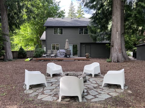 Relaxing outdoor furniture, fire pit, games  to enjoy nature walking by.