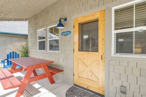 Larger patio with chairs, table and propane BBQ.