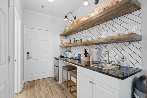 Kitchenette with granite counter tops.