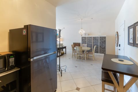 The kitchenette is equipped with granite countertops, a Keurig coffee maker, toaster, microwave, and refrigerator.