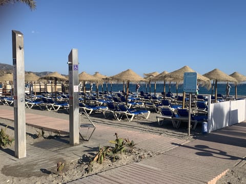 On the beach, sun loungers