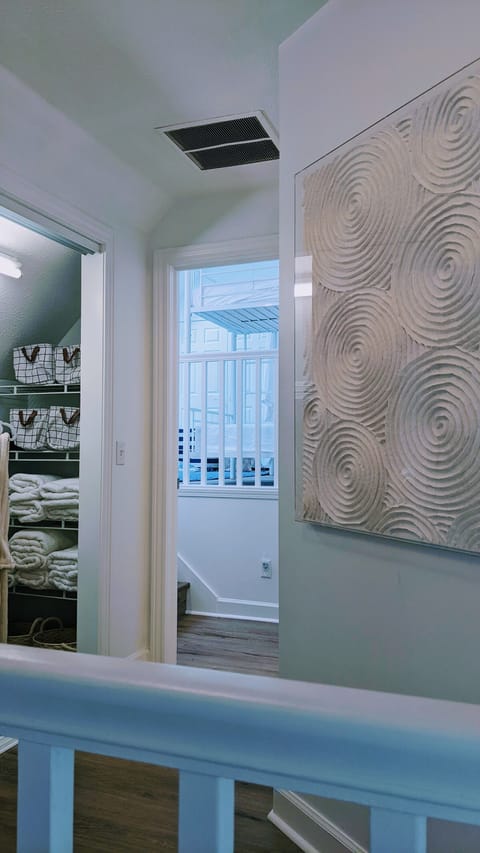 Linen closet with extra blankets and supplies.