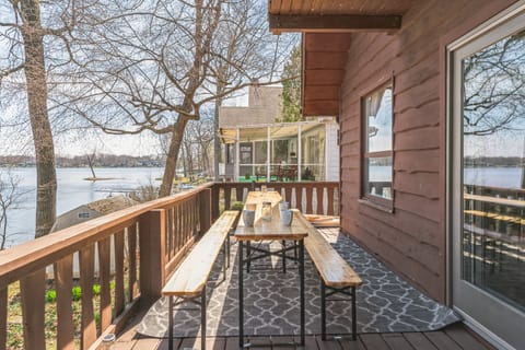 Two outdoor tables on the main level balcony.