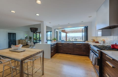 Counter height table seats 5; Nana Window opens fully for pass through to BBQ