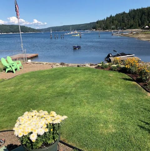 Private, manicured yard with Alderbrook straight ahead. Two steps to beach.