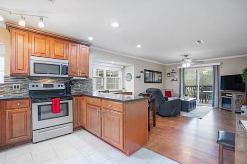 With our spacious kitchen island! The perfect spot to prep meals, enjoy a casual bite, or sip a glass of wine while chatting with friends.