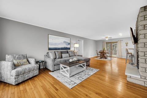 Spacious Open Living Room with Large Flat Screen TV