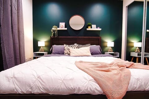 Gorgeous king bedroom with TV and private bathroom and balcony