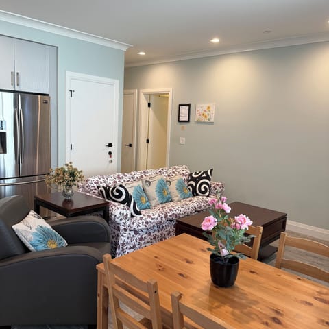 Living room with sofa & dining sets.